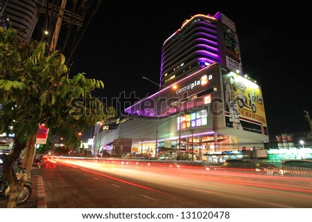 BANGKOK-JAN 18: Light trails on street and Central Rama 9, the famous shopping mall, located near Rama 9 junction on January 18,2013 in Bangkok,Thailand. Visitors can be here by MRT subway transit.