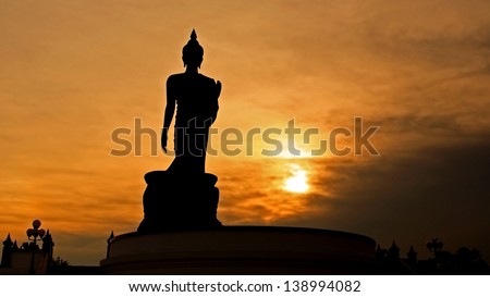 Buddha statue in Silhouette scene at sunset at Phutthamonthon or Buddha Monthon, Thailand
