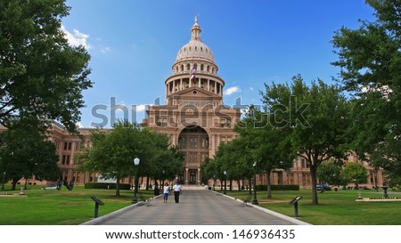 AUSTIN,TEXAS-JUL 19: Unidentified people at entrance of Texas state capitol in Austin, Texas on July 19, 2008. Capitol has 360,000 square ft. of floor space, more than other state capitol buildings.