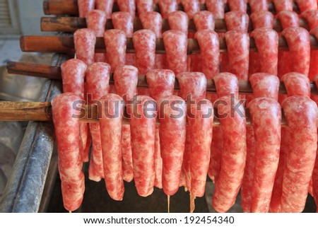 Tasty meat sausages during manufacturing process before sale in Thailand