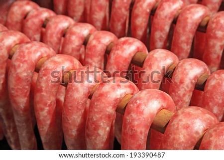 Tasty pork sausages during manufacturing process before sale in Thailand