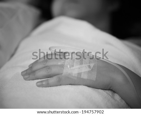 Hand of a female patient in the hospital with an IV, Intravenous therapy