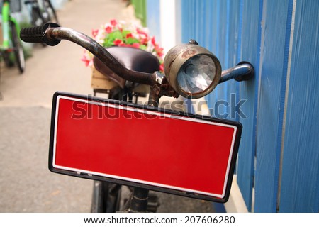 bicycle with red banner carrying flowers pot for decoration