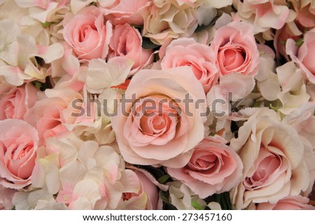 Artificial pink rose flowers for wedding decoration, Textured background