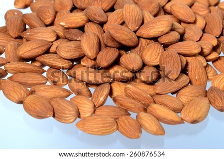 A few almonds scattered on the surface.