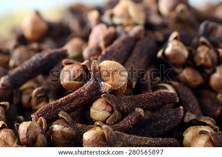 Cloves (spice) in bamboo basket isolated on white background