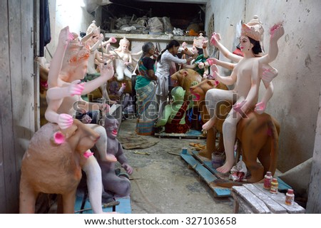 NAGPUR, MS, INDIA - OCT 13: An unidentified artist makes sculptures of goddess Durga on October 13, 2015 in Nagpur, Maharashtra, India. The idols are made for the Hindu festival of Dasara & navratri.