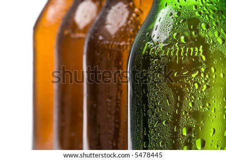 Bottle of light beer on a background of empty bottles.