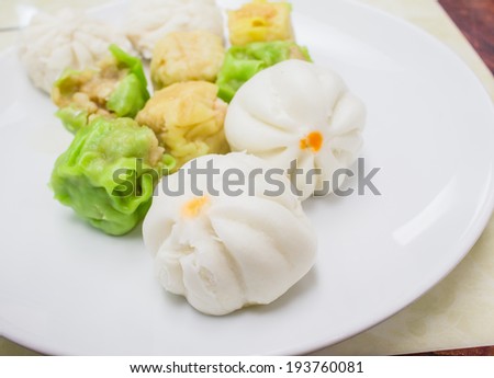 Chinese steamed dumpling on white plate