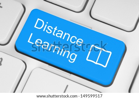 Blue distance learning button on white keyboard