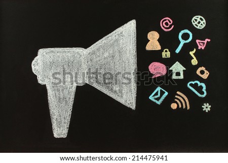 Chalk megaphone with flying icons drawn on blackboard by hand not in photoshop Chalk megaphone with flying icons drawn on blackboard by hand not in photoshop