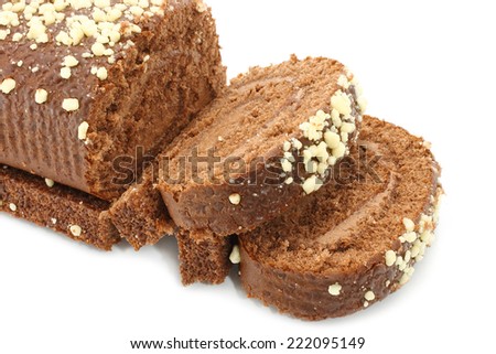 Chocolate Swiss roll closeup on a white background