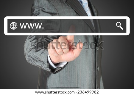 Businessman pushing virtual search bar on black background, internet concept