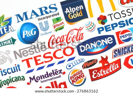 KIEV, UKRAINE - MAY 07, 2015:Collection of popular food logos companies printed on paper:Coca-Cola, Mars, Kraft, Pepsi, McDonaldâ??s, Nestle, Tesco and others.