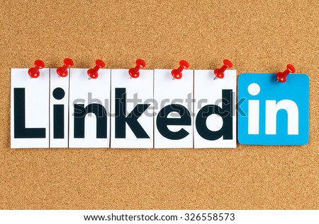 Kiev, Ukraine - October 07, 2015: Linkedin logo sign printed on paper, cut and pinned on cork bulletin board. Linkedin is a business social networking service.