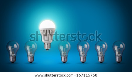Row with light bulbs and LED bulb. Idea concept on blue background