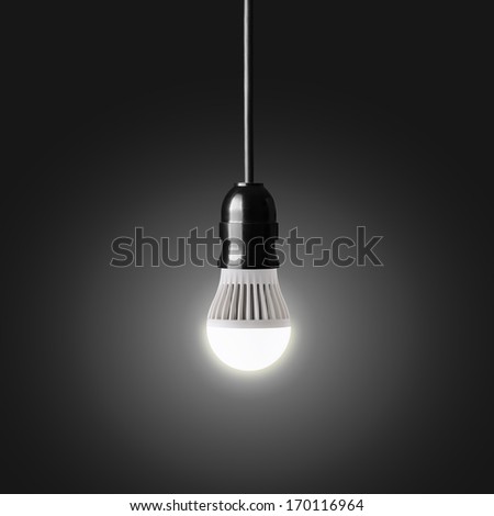 Glowing LED bulb on black