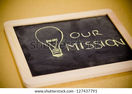 lighbulb and business mission chalk design on blackboard