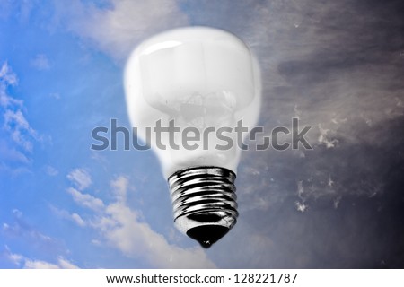 good and bad ideas, lightbulb with half serene half dark sky