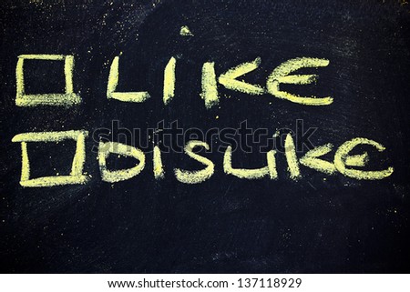 chalk writings on blackboard, choice between like or dislike