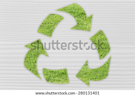 green economy and ecology: symbol of recycling made of grass