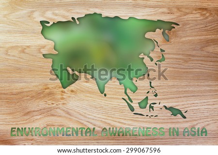 environmental awareness throughout the world: illustration with map of asia made of green leaves blur