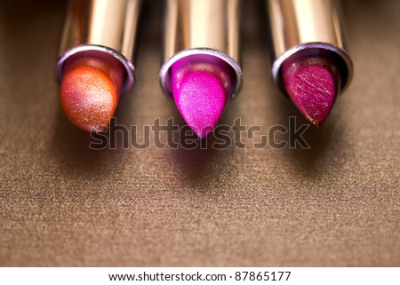 purple, red and orange lipsticks
