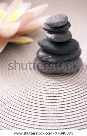 zen pile of stone and lotus flower, balance and meditation concepts