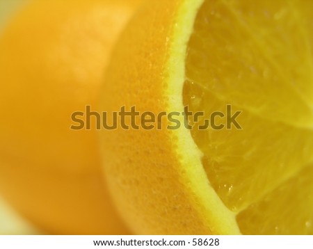 Orange cut in half, focus placed on the cut edge.