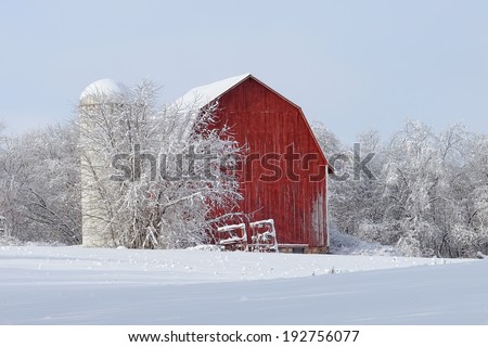 Red Barn covered with snow Winter countryside in Michigan