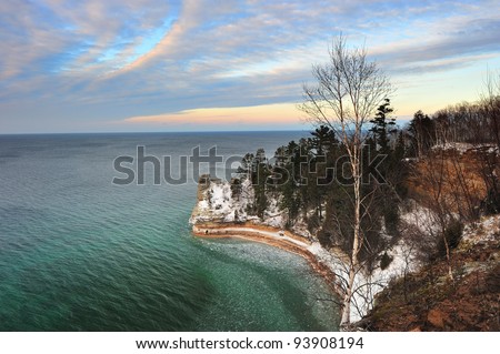 Winter sunset at Miners Castle, Pictured Rocks National Lake-shore.  Beautiful clear, emerald Green water, in Michigan\'s Lake Superior.