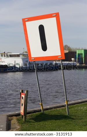 A waterway sign which says: Watch Out!
