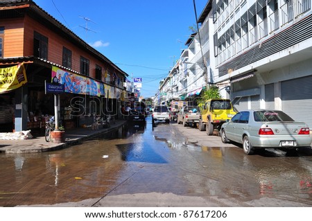 CHACHOENGSAO, THAILAND - OCTOBER 29: Rising tide from Bangpakong River overflow into roads, market and houses in October 29, 2011 in Chachoengsao, Thailand.