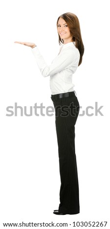Full body of happy smiling young beautiful business woman showing blank area for sign or copyspase, isolated over white background