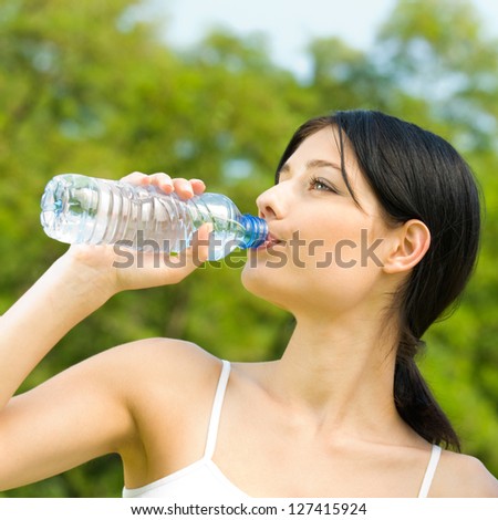 Portrait Of Woman Drinking Water Outdoor