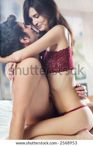stock photo Couple and hugging on bed in bedroom in passion