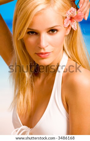 stock photo Portrait of young beautiful tanned blond sexy woman in bikini 