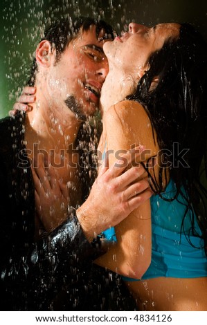 couple kissing in rain. couple kissing in rain.