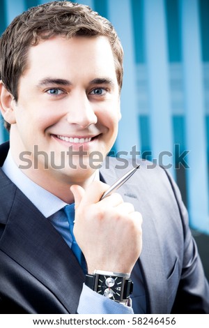 Portrait of successful businessman at office