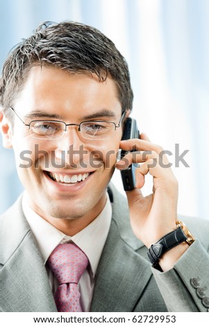 Businessman with phone at office