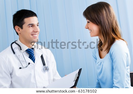 Doctor and patient with prescription at office
