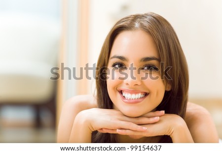 Portrait of young beautiful happy smiling woman, at home
