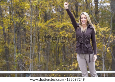 Beautiful woman cheering on her team in an outdoor environment