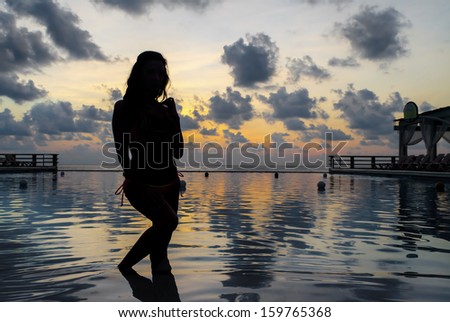 Silhouette of a model on a beach in the caribbean