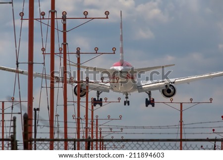 A commercial aircraft landing at an airport