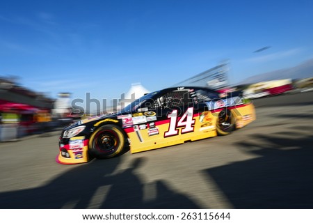 Fontana, CA - Mar 21, 2015:  Tony Stewart (14) takes to the track to practice for the Auto Club 400 at Auto Club Speedway in Fontana, CA.