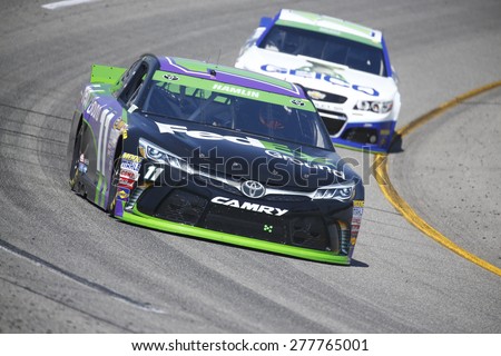Richmond, VA - Apr 24, 2015:  Denny Hamlin (11) brings his race car through the turns during a practice session for the Toyota Owners 400 race at the Richmond International Raceway in Richmond, VA.