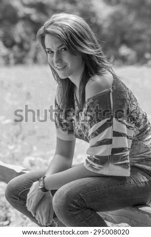 A beautiful brunette model posing in an outdoor environment