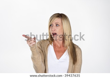 stock photo Mature model pointing towards the side against a white 