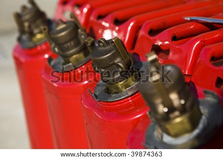 Red gas cans sit outside ready to be used